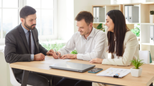 client meeting with three people sitting at table