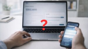 business owner looking at laptop screen with question mark on screen.